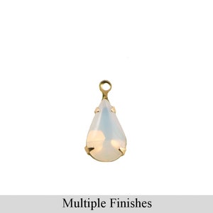 May include: A teardrop-shaped, white opal pendant with a gold setting. The pendant has a loop at the top for attaching to a chain or cord.