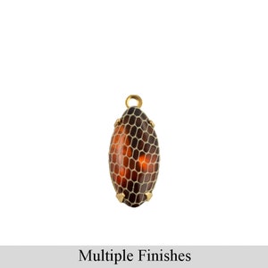 May include: A gold-toned pendant with a brown and white oval-shaped stone. The stone has a textured pattern resembling a snake skin.