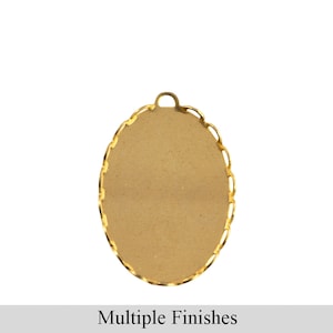May include: Gold oval-shaped pendant with a decorative edge. The pendant has a smooth surface and a loop at the top for attaching a chain.