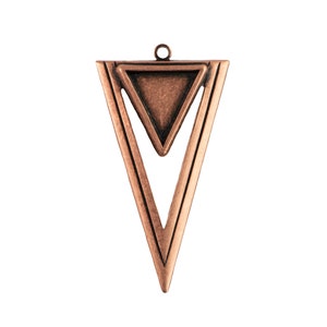 May include: A copper-colored pendant with a geometric design. The pendant features an outer inverted triangle shape with a smaller triangle inside. A small loop is at the top for hanging. The pendant has a vintage, antique look.