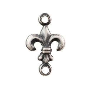 May include: Silver-toned metal charm featuring a fleur-de-lis design with two jump rings.