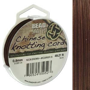 May include: A spool of 0.8mm (0.031 in) neon brown nylon cord for knotting, braiding, and macrame. The spool is labeled "Bead Smith Chinese knotting cord" and has a length of 49.21 feet (15 meters).