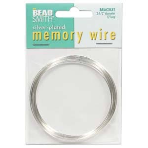 May include: Silver-plated memory wire for bracelets, 2.5 inches in diameter, from Bead Smith. The package features a white background with a teal and yellow header. The text "BRACELET 2-1/2" diameter 12 loops" is printed on the top right.
