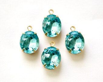 Aqua Blue Faceted Oval Stones in 1 Loop Brass Setting 12mmx10mm (4) ovl011L