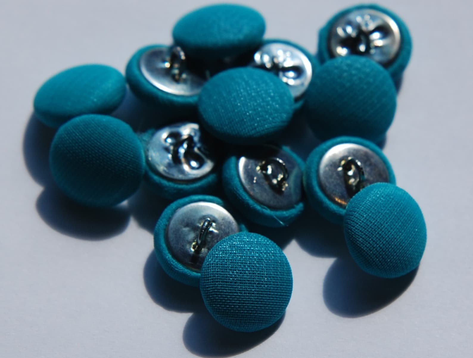 Blue silk covered buttons