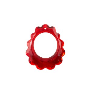 May include: A red crystal sunburst pendant with a hole in the center for stringing.
