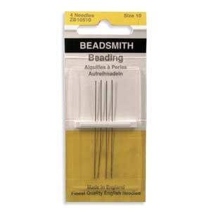 May include: A package of BEADSMITH beading needles. The package is white, black, and yellow, with the text "BEADSMITH Beading" and "4 Needles" visible. The needles are thin and silver, size 10. The package also says "Made in England".
