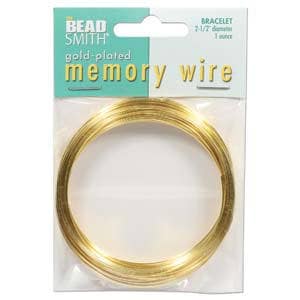May include: Gold-plated memory wire for bracelets, packaged in a clear plastic bag. The package features the text "The Bead Smith" and "gold-plated memory wire". The wire is approximately 2-1/2 inches in diameter.