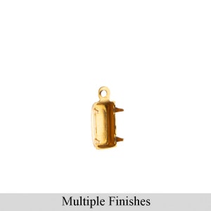 May include: Gold-toned metal connector with a rectangular shape and a small loop at the top. The connector has two small prongs on each side.
