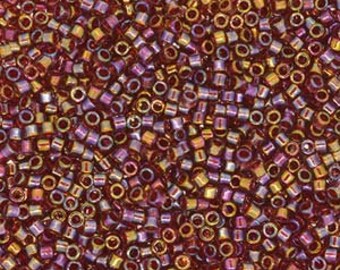 May include: A large quantity of small, round, iridescent seed beads in shades of red, gold, and purple.