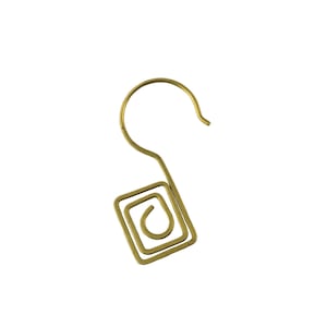 May include: A gold-colored metal hook with a square-shaped design. The hook is made of wire and has a simple, modern design.