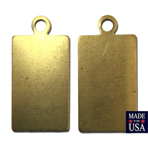 May include: Two blank brass rectangular tags with a hole at the top for hanging. The tags are made in the USA.