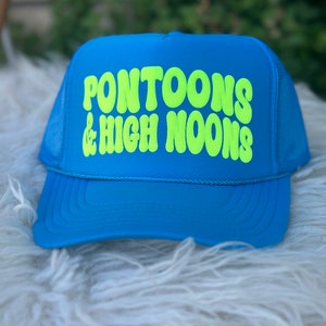 May include: A blue trucker hat with a neon green logo that says "Pontoons & High Noons".