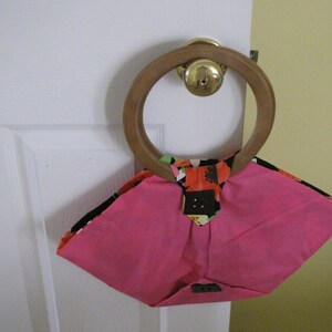 Bold and Beautiful: Hot Pink Triangle Bag with Wooden Handles and Vibrant Lining
