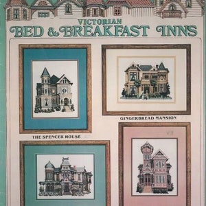 May include: A Victorian Bed & Breakfast Inns cross-stitch pattern featuring four framed house designs: The Spencer House, Gingerbread Mansion, The Morey Mansion, and Rose Victorian Inn. The top of the image shows a row of Victorian house illustrations.