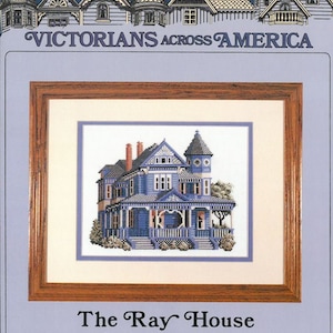May include: Cross stitch pattern of a blue Victorian house with a porch and a turret, titled "The Ray House, Gallatin, Missouri".