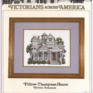 May include: Counted cross-stitch pattern for the Pillow-Thompson House in Helena, Arkansas. The pattern features a detailed illustration of a Victorian-style house with a porch and a garden. The pattern is titled "Victorians Across America" and is by Debbie Patrick.