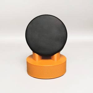 Hockey Puck Display Stand Base – Slanted PLA Holder with Puck Texture, 8 Colors, Unique Design with Bumpers for Desk or Shelf