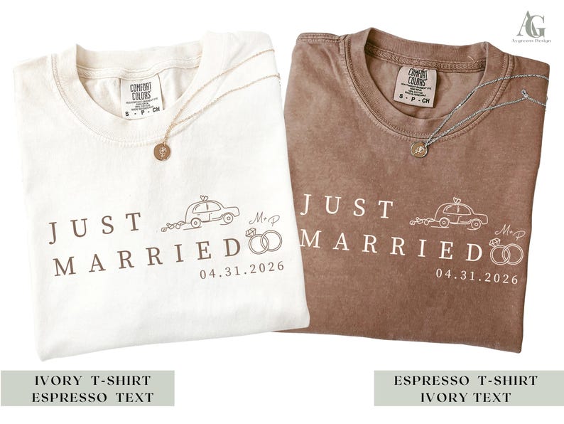 May include: Two Comfort Colors t-shirts, one ivory and one espresso, with the text "JUST MARRIED" and a car graphic. Each shirt has a necklace with a pendant. The date "04.31.2026" is printed below the text.