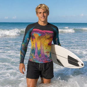 May include: A long-sleeve rash guard featuring a vibrant, colorful graphic print of large mushrooms in shades of pink, purple, yellow, and blue against a dark background, paired with solid black athletic shorts and a white surfboard.
