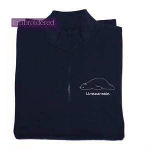 a polo shirt with a picture of a polar bear on it