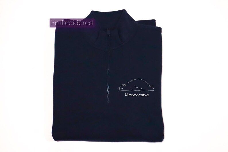 a polo shirt with a picture of a polar bear on it