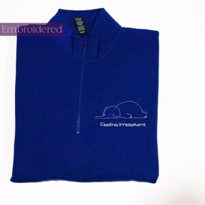 a blue vest with a picture of a polar bear on it