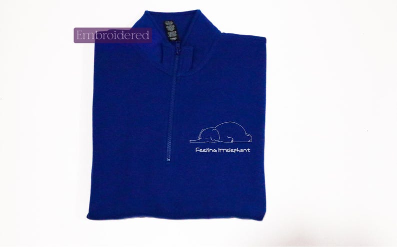 a blue vest with a picture of a polar bear on it
