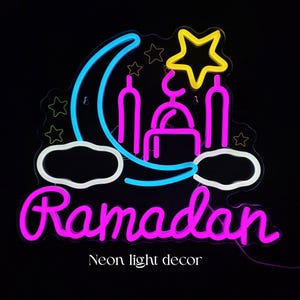 May include: Neon sign with a black background featuring a crescent moon, stars, and a mosque silhouette in blue, yellow, and pink. The word "Ramadan" is written in pink script, with "Neon light decor" below.