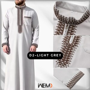 Men’s light grey thobe with Moroccan-style brown embroidery around the collar and front, featuring a zip neckline. Traditional Islamic thobe for men, also known as Arabic thobe, Saudi thobe, jubbah, jubba or dishdasha. Elegant Muslim clothing for Eid, Ramadan and special occasions.
