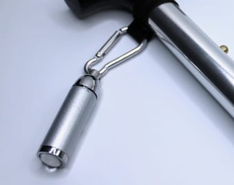 Brushed silver Mini torch for walking sticks, bags, purses.  With clasp, ready to use. Great for the person who has everything, extra safety