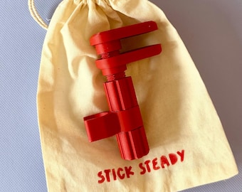 Red Stick Steady, walking stick accessory, brand new design, secure your cane at your desk or table. Fab gift idea, individual linen bag.