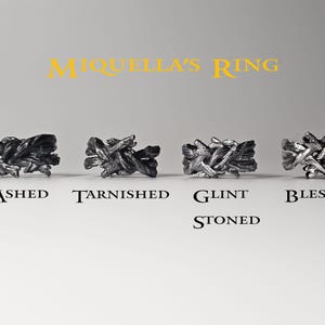 May include: Four silver rings with different finishes, labelled "Ashed", "Tarnished", "Glint Stoned", and "Blessed".