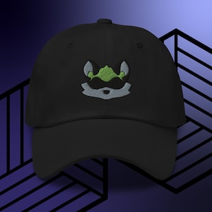 May include: Black baseball cap with an embroidered green and gray cartoon fox head.