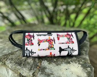 Small sewing bag with 3 zippered suspended pockets, long outer zipper with 2 pullers to open wide