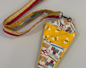 Tool holder with 3 sections and detachable lanyard, with seam ripper attached