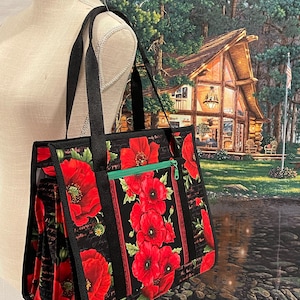 Ultimate carry all bag for quilting, sewing and crafts, 18 pockets, back pocket with sleeve for roller cart, ironing pad on flap side