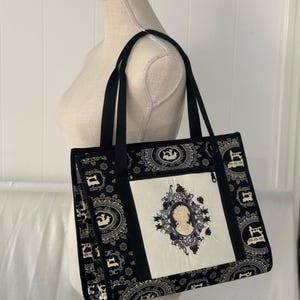 Ultimate carry all bag for quilting, sewing and crafts, 18 pockets, sleeve on back pocket for roller cart, ironing pad inside, embroidered