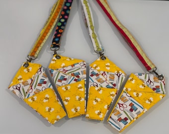 Tool holder with 3 sections and detachable lanyard, with seam ripper attached