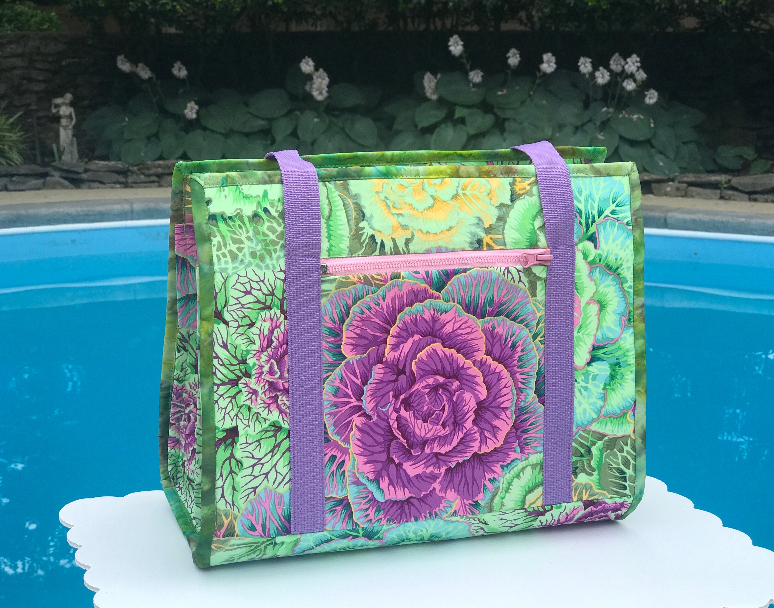 Ultimate Carry All Bag for sewing, quilting, beading and other crafts, 18 pockets, roller cart sleeve, ironing pad on a flap side