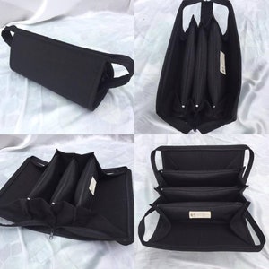 May include: Black zippered travel case with three compartments and two handles. The case is open to reveal the interior compartments.