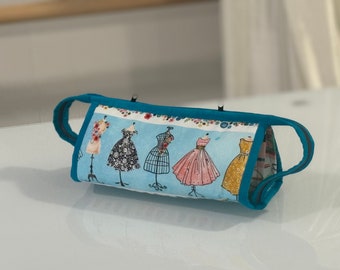 Small sewing bag with 3 zippered suspended pockets, long outer zipper with 2 pullers to open wide