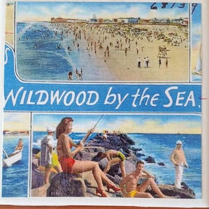 May include: A vintage postcard featuring a beach scene with the text "WILDWOOD by the SEA." The postcard shows a beach with people swimming and sunbathing, and a boardwalk in the background. The postcard is in good condition, with some minor wear and tear.