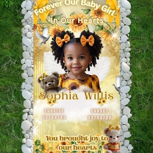 May include: A memorial plaque with a photo of a young girl, Sophia Willis, surrounded by sunflowers and doves. The text reads "Forever Our Baby Girl In Our Hearts." The dates 05/29/23 and 02/08/25 are also included.