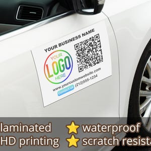 May include: A white car door with a laminated, waterproof, scratch-resistant magnet. The magnet features a QR code, a logo placeholder, and the text "YOUR BUSINESS NAME", "YOUR LOGO HERE", "www.yourcustomwebsite.com", and "Contact us (212)555-1234".