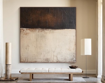 May include: A large abstract painting with a textured surface, featuring a dark brown upper section and a cream-colored lower section. A light-colored bench with a wooden frame sits below the artwork. A floor lamp and a decorative wooden pillar are also visible.