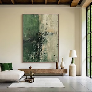 May include: Large abstract painting with a textured surface, featuring shades of green, white, and black. The artwork is displayed in a modern living room setting, above a wooden console. The room includes a white sofa, a rug, and a floor lamp.