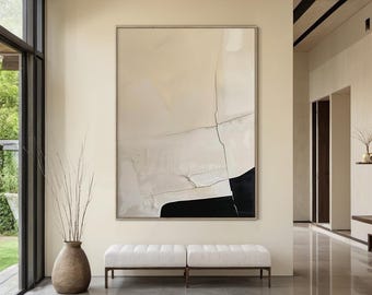 May include: Large abstract painting with a neutral color palette. The artwork features a cream-colored background with black and white geometric shapes and lines. A pair of white upholstered benches with dark metal legs are in front of the painting.