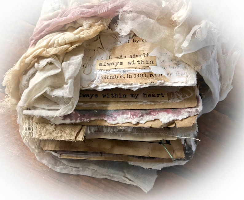 May include: A stack of vintage paper and fabric scraps with the text "always within" and "always within my heart" visible. The paper and fabric are in shades of white, brown, and pink.