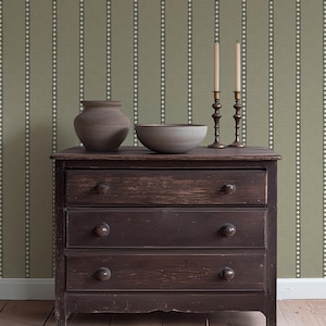 Sage green and white vertical stripe wallpaper with crosses and woven texture for a southwestern cowboy mancave, farmhouse ranch or lodge
